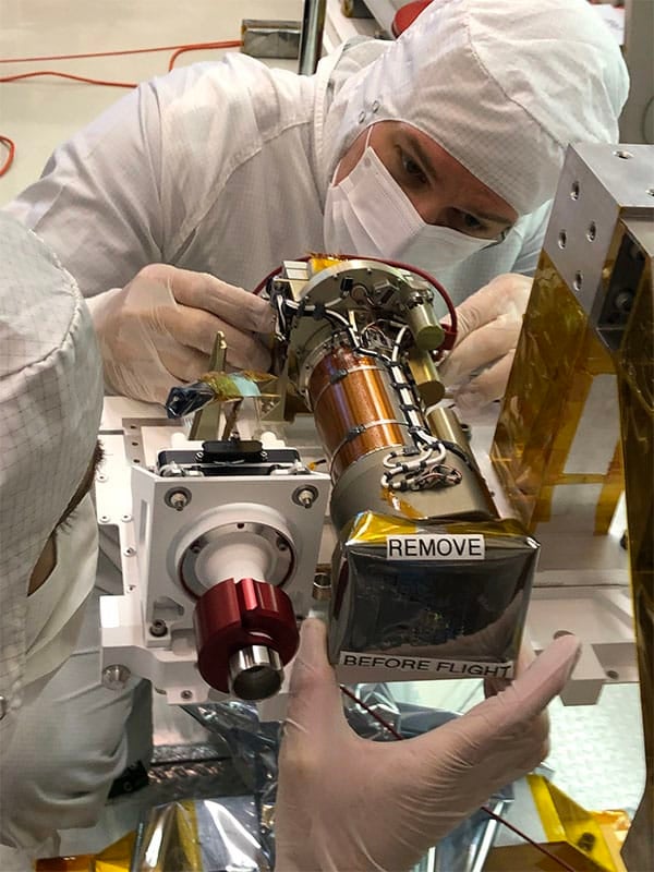 JPL technician Seth Harvey installs the left Mastcam-Z camera head during the June 2019 integration of the Mars 2020 mission’s Perseverance rover’s remote sensing mast (RSM).